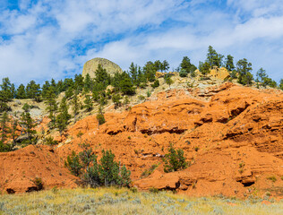View of Devils Tower With Red Cliffs, Devils Tower national Monument, Wyoming, USA