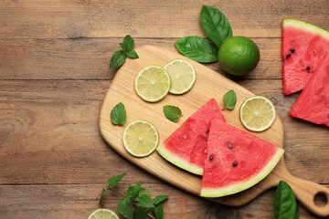 Tasty sliced watermelon and limes on wooden table, flat lay