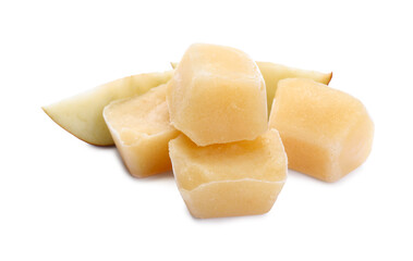 Frozen apple puree cubes and fruit on white background