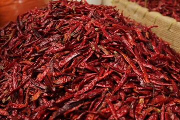 Pile of spicy dried red chili peppers at market