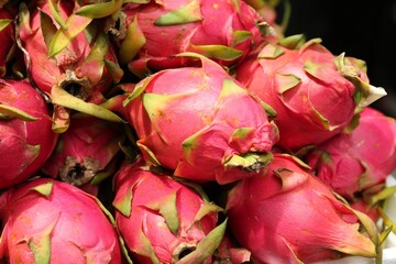 Pile of delicious fresh ripe pitahayas, closeup