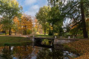 The bridge over the Upper Ponds to the kitchen ruins in Catherine Park of Tsarskoye Selo on a sunny...