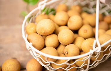 Longan - exotic fruit on wooden table, closeup