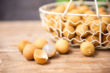 Longan - exotic fruit on wooden table, closeup