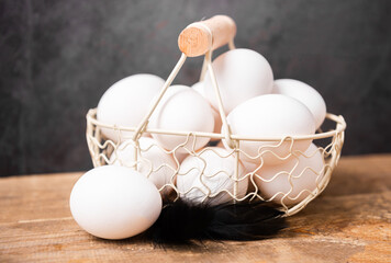 Fresh white eggs in the basket