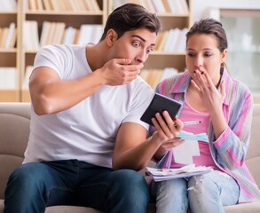 Young family discussing family finances