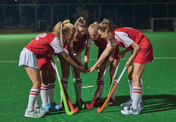 Hockey, together hands and women teamwork, support or motivation for game, competition or training strategy communication. Leadership, sports and group hand stack circle in target goal collaboration © L Ismail/peopleimages.com