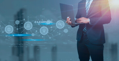 Businessman in black suit holding laptop and virtual screen on blue background, e-learning education Internet Technology Webinar Online Courses concept.