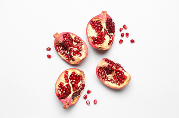 Pieces of pomegranate on white background