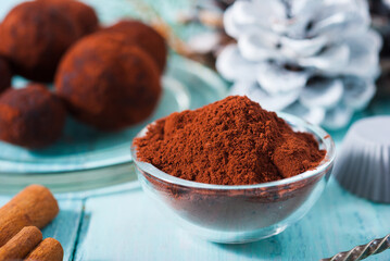 Christmas chocolate truffles and spices on shabby chic blue wood table