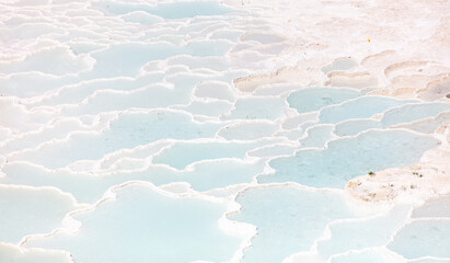 Emerald water in white limestone rock.