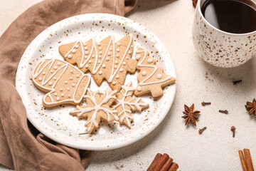 Fototapeta na wymiar Plate of tasty Christmas cookies on light background, closeup