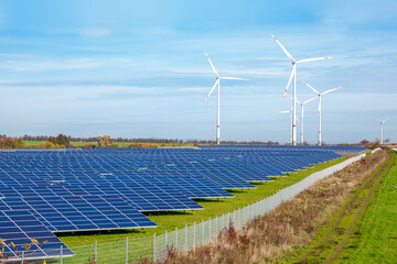 
solar panels and wind turbines in a field , photovoltaics, alternative electricity source. concept...