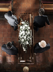 Funeral, family coffin and church above for death, grief or burial service with solidarity. Group,...