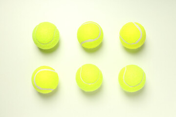 Flat lay with tennis balls on white background