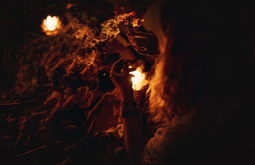 incense in a woman hand, ceremony space.