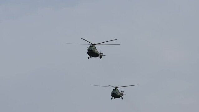 military helicopters flying on a mission