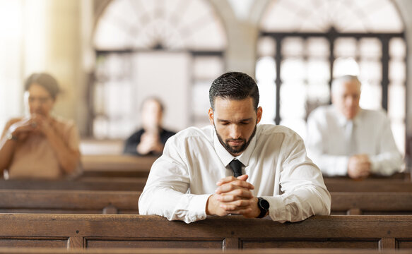 Church, prayer and man praying to God, worship or religion in cathedral. Faith, spiritual and christian community in chapel or sanctuary worshipping Jesus, holy praise or trust and hope in Christ.