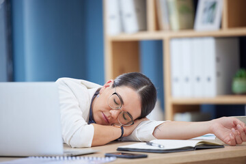 Burnout, sleeping and tired business woman in office after working overtime or overwork. Rest, relax and exhausted sleepy female employee taking nap by table after all night work on project deadline