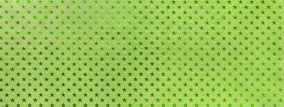 Light Green Christmas Background From Metal Foil Paper With A Pattern Of Sparkling Stars, Macro. Olive Backdrop.