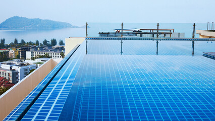Fototapeta na wymiar Luxurious rooftop pool. Swimming pool, vacation, seaview