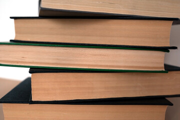 stack of books on white background copy space. Old books
