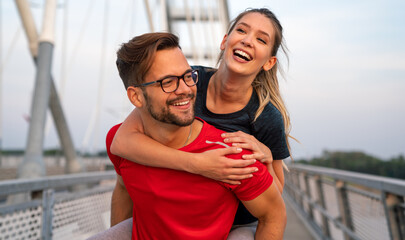 Romantic couple doing sport together on the street. Having fun after morning run © NDABCREATIVITY