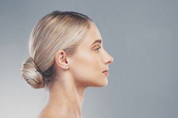 Skincare, profile and side face of a woman for dermatology, wellness and natural beauty against a grey mockup studio background. Advertising, marketing and model with cosmetic health and space