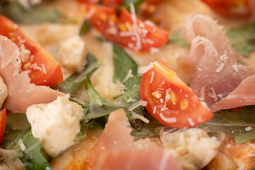 Pizza background. Macro shot of Prosciutto pizza.
