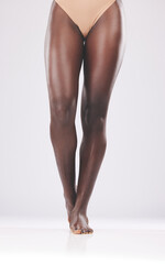 Beauty, skin and legs by black woman in studio for skincare, laser and hair removal against white...