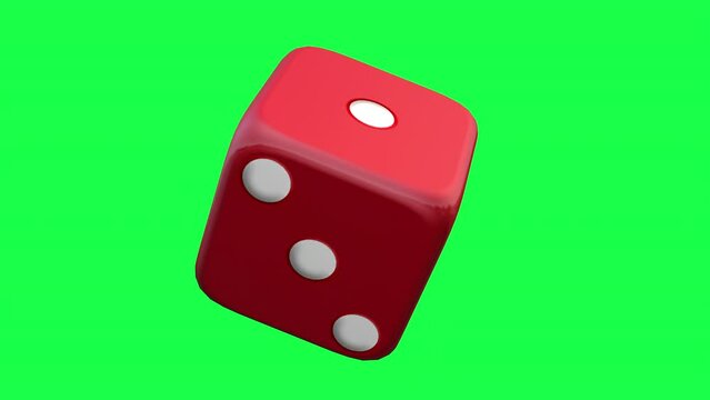 red dice on green background