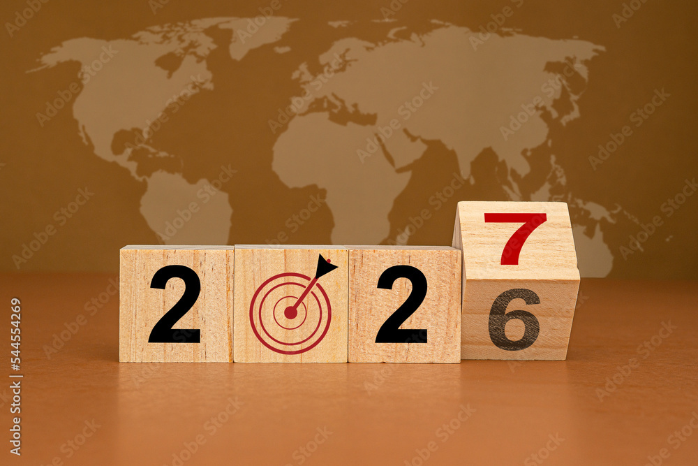 Poster countdown and business planning in 2027. wooden cubes with the letters 2027 on a table with the worl