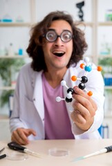 Funny male chemist working in the lab