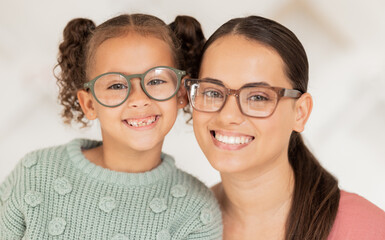 Mother, girl and glasses in optometry shop, frame and happy after shopping in retail store with...