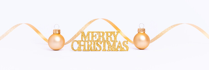 Merry Christmas banner. Shiny Merry Christmas card with golden glitter lettering. Gold baubles and...