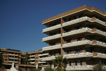 Ostia, Rome, Italy - November 06, 2022, architectural detail of a large social housing complex, near the large pine forest of Ostia, seen from the seafront.