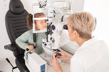 Girl child in eye exam for vision, woman optician checking kids eyes in consultation room and medical test. Healthcare professional consulting kid, young patient with optometrist or optical doctor