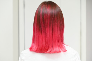 Beautiful hair coloring fuchsia ombre. Multicolored.
