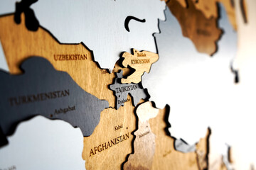 Political map. Kyrgyzstan, Tajikistan, Afghanistan, Pakistan, Egypt on wooden world map on the wall.