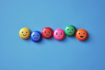 A variety of human emotions: joy, serenity, anger, sadness on colored balls