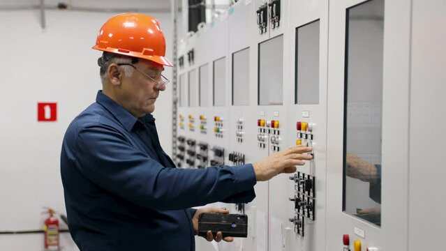 An electrical engineer inspects the electrical system of a maintenance cabinet, a technician or electrician checks the power distribution.