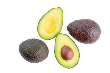 whole and half avocado isolated on transparent background close-up.
