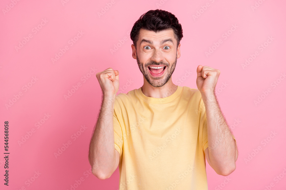 Canvas Prints photo of impressed astonished guy with brunet hair dressed yellow t-shirt clenching fists win lotter