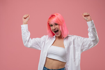 Young emancipated woman posing for the camera in a studio