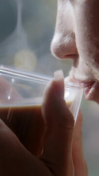 Close up of a girl drinking coffee
