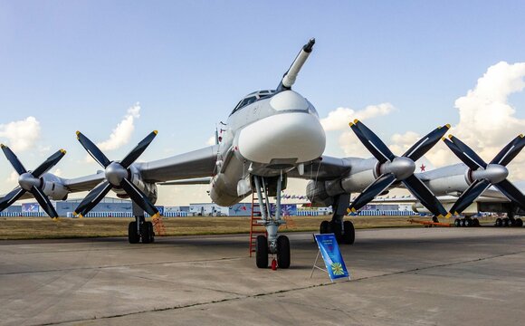 Soviet and Russian turboprop strategic bomber-missile carrier Tu-95MS (NATO: -  Bear) at stationary parking lot  100th anniversary of Russian Air Force.. Zhukovsky, Russia - August 10, 2012