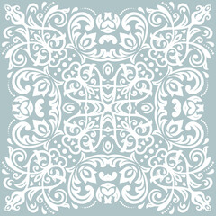 Oriental light blue and white pattern with arabesques and floral elements. Traditional classic ornament. Vintage pattern with arabesques