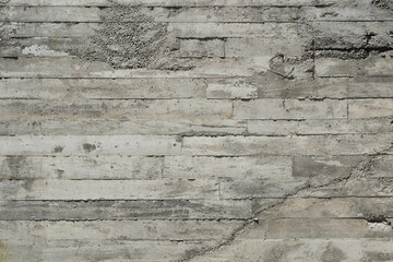Grey rough textured concrete wall, wood plank board formed concrete wall texture, background.