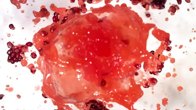 Slow Motion of Explosion Pomegranate Seeds and Burst Red Juice