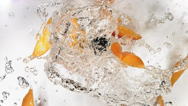 Slow Motion of Explosion Mango Slices and Burst Water Juice